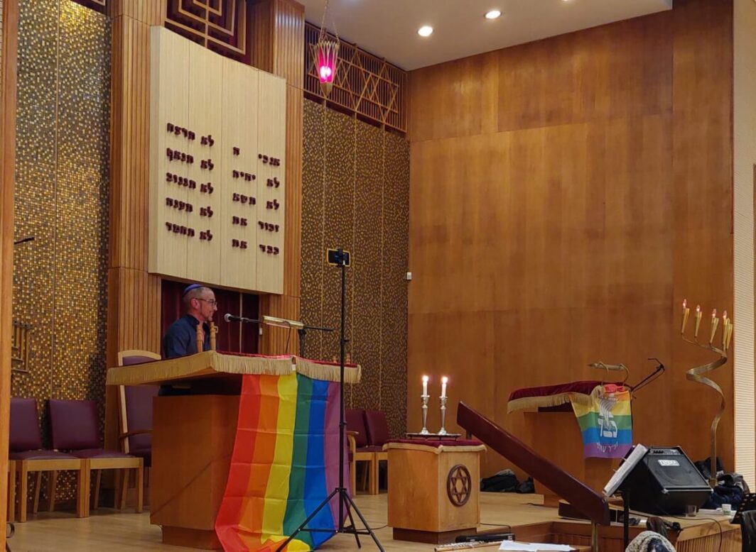 Shaan Knan speaking at Pride Shabbat