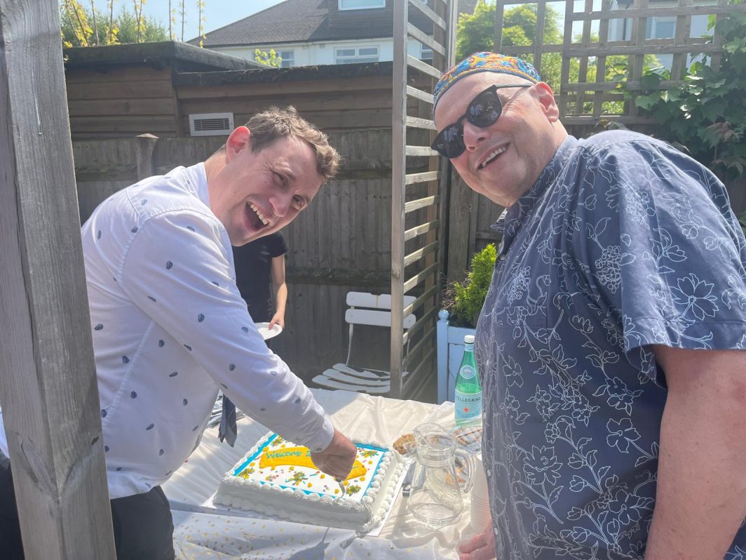 Rabbis Lev and Rene cut the cake